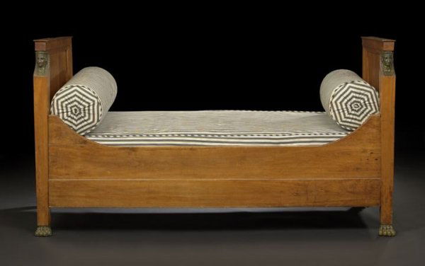 Empire-Style Fruitwood Daybed: Empire-Style Fruitwood Daybed, late 19th century, the headboard and footboard each paneled and with a front caryatid column ending in ormolu paw feet, joined by shaped rails, h. 43-3/4", inside w. 39-