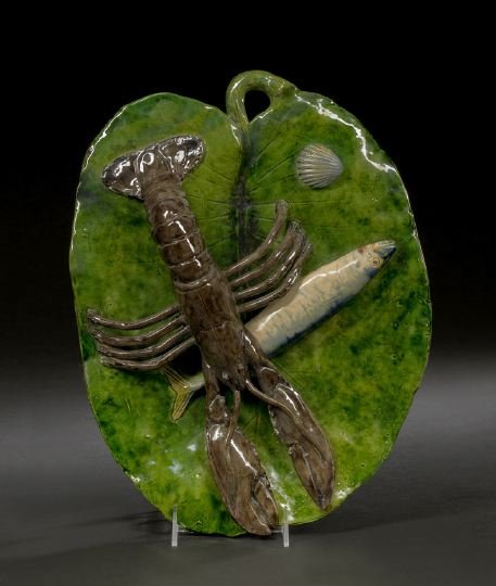Renoleau, Polakowski et Cie., Palissy Plaque: A. Renoleau, Polakowski et Cie., Roumazieres, Palissy Ware Plaque, ca. 1889-1891, in the form of a leaf overlain by a langouste, signed on the reverse in impressed underglaze block letters, w. 12-1/2"