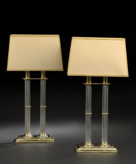 Pair of French Chromium and Mirrored Table Lamps: Pair of French Gilt-Brass-Mounted Chromium Double-Column Table Lamps, the chromium columns fluted and supported on an oblong gilt-brass-framed mirrored glass base, each lamp fitted with a custom oblon