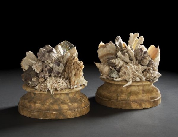 Large Pair of Italian Grotto Garnitures: Large and Attractive Pair of Italian Grotto Garnitures, each composed of antiqued seashells, white coral, agate and pyrite on circular faux-marbre bases, h. 11-1/2" and 13".