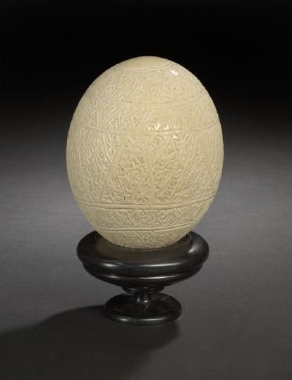 Indian Leaf-Carved Ostrich Shell: Indian Leaf-Carved Ostrich Shell, fourth quarter 19th century, presented on a custom turned ebony circular display stand, h. 8-1/4".