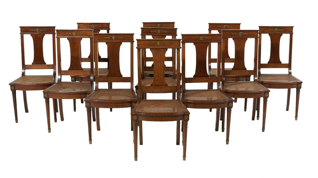 Eleven Neoclassical-Style Mahogany Dining Chairs: Suite of Eleven Neoclassical-Style Mahogany Dining Chairs each having a back with a top rail with an ormolu mount centered by a bust of Mercury, a shaped splat, a bowed and caned seat rail, and raised