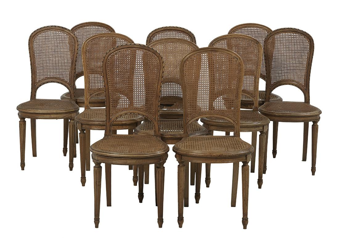 Ten Provincial Louis XVI-Style Dining Chairs: Suite of Ten Provincial Louis XVI-Style Beechwood Dining Chairs each Beechwood with a caned back and carved compass-form seat, raised on fluted tapering circular legs. h. 38"