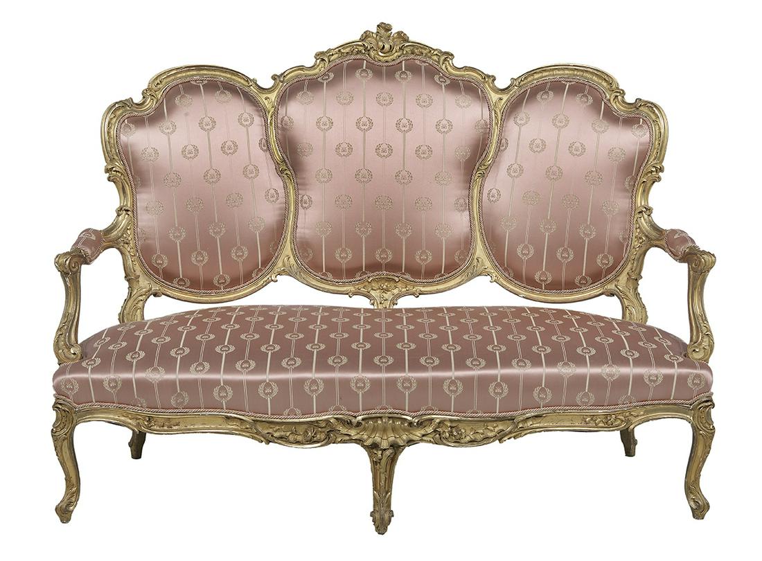 Napoleon III Giltwood Settee: Napoleon III Giltwood Settee third quarter 19th century, in the Louis XV taste, the padded trisected back surmounted by a foliate shield crest, joined by padded scrolling arms to the padded seat, rais