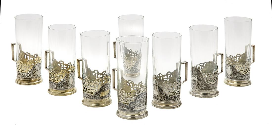 Soviet Causasian Silver Niello Tea Glasses: Assembled Set of Eight Soviet Causasian Silver Niello Tea Glasses third quarter 20th century, Kubachi, Dagestan (one Baku, Azerbaijan), the .875 silver podstakanniki in the "Flower Crescent" pattern, 