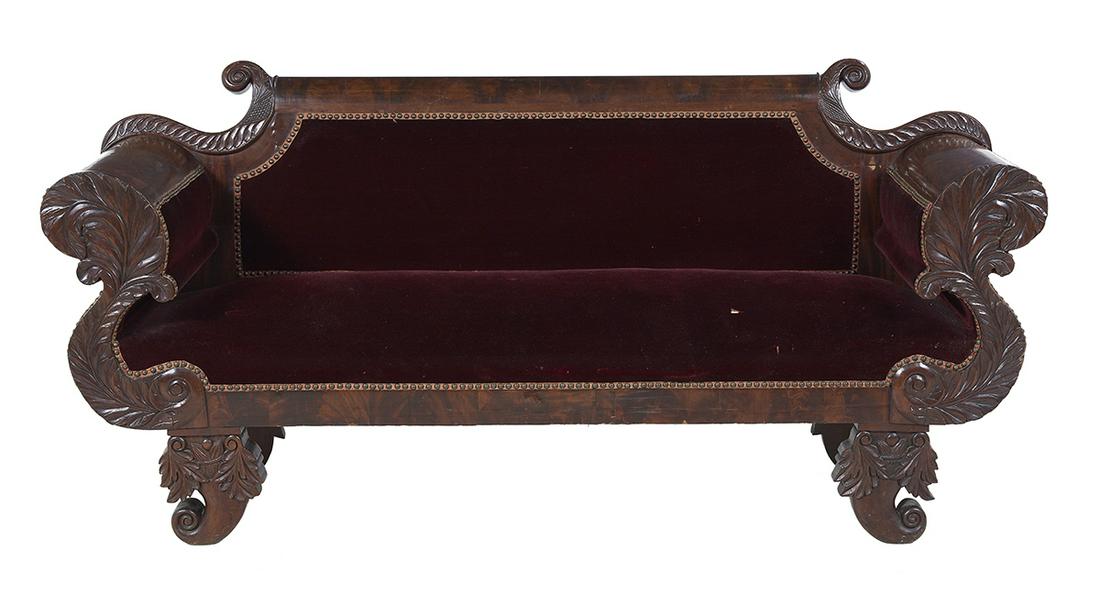 American Late Classical Mahogany Sofa: American Late Classical Mahogany Sofa mid-19th century, the molded top rail flanked by leaf-carved brackets, the S-curved arm supports with like carving, raised on foliate-carved scroll feet. h. 36-1/