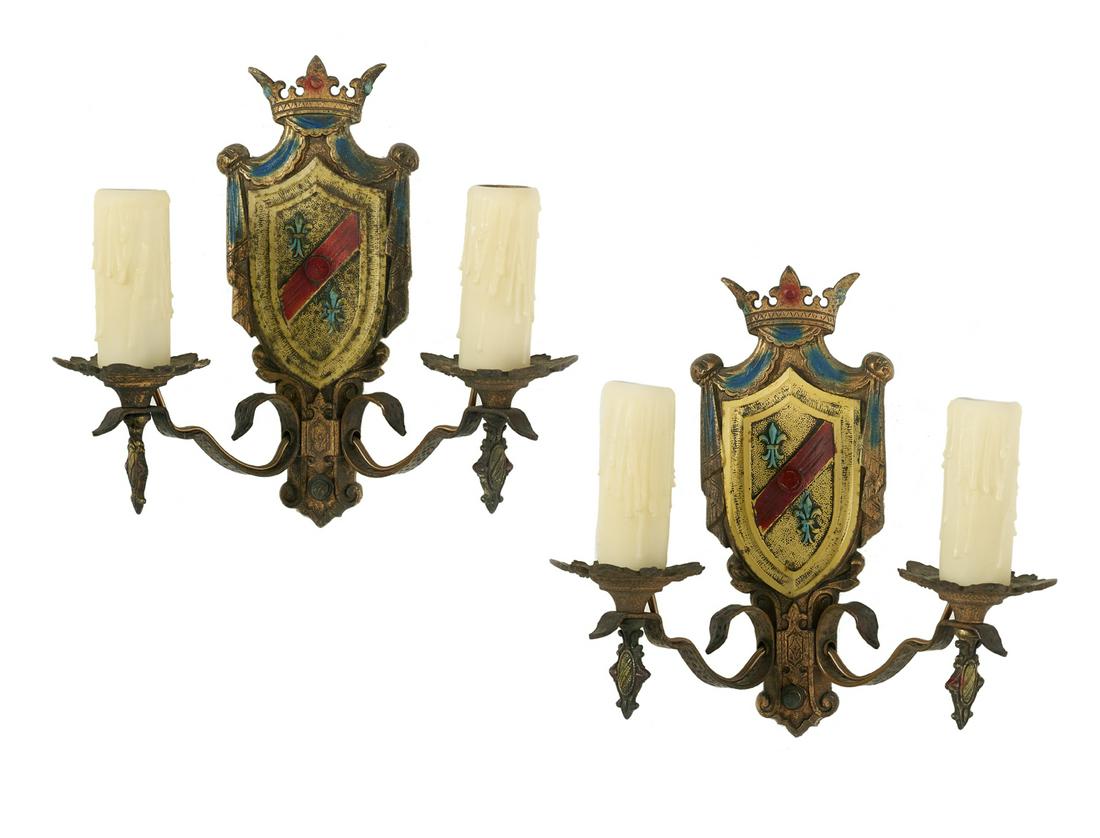 Pair of American Enameled Metal Two-Light Sconces: Pair of American Enameled Metal Two-Light Sconces second quarter 20th century, in the Baronial taste, each with a shield-form backplate set with a crown finial and a pair of scrolled arms with molded 