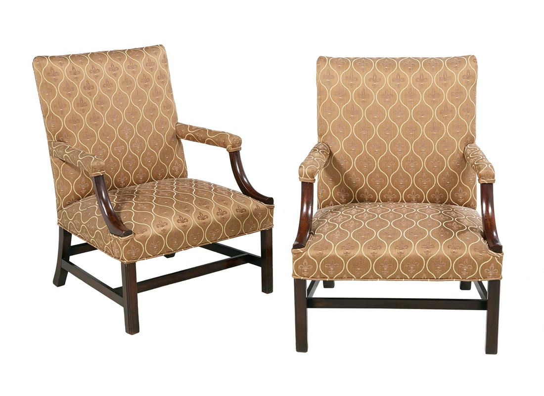 Pair of George III-Style Gainsborough Chairs: Pair of George III-Style Mahogany Gainsborough Chairs each with an upholstered back joined to open arms on shaped supports, and raised on square legs with molded and chamfered outer edges, joined by H