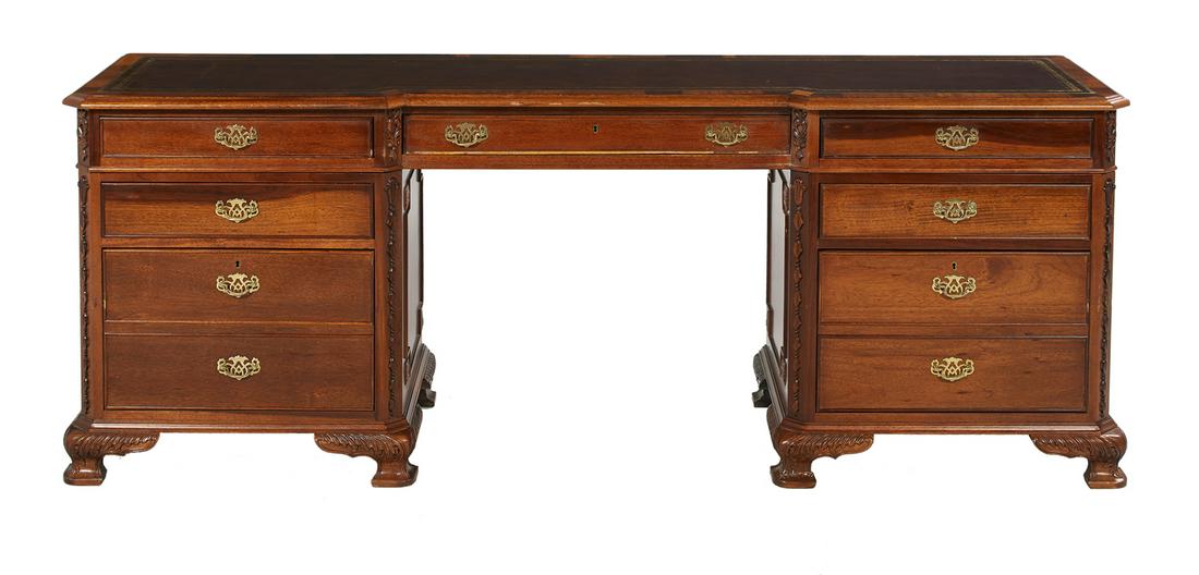 George III-Style Mahogany Console/Desk: George III-Style Mahogany Console/Desk in the Chippendale taste, the tripartite top with an inset tooled leather writing surface over a bank of three drawers, on a double pedestal base, each with a pa