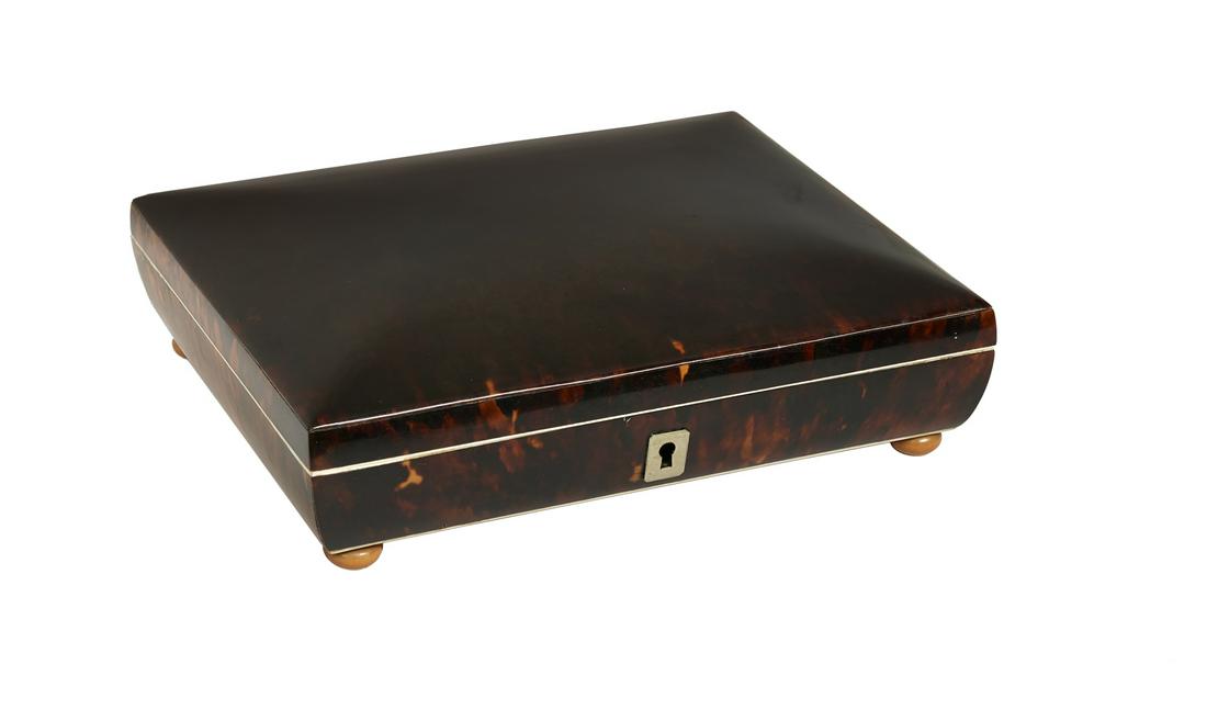 English Tortoiseshell Jewel Case: English Tortoiseshell Jewel Case second quarter 19th century, with rounded sides and cover and a satin-lined interior, raised on turned feet. h. 2", w. 7-1/2", d. 6-1/2"