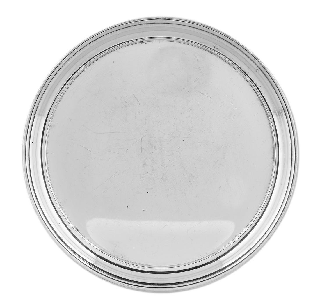 Cartier Sterling Silver Salver: Cartier Sterling Silver Salver 20th century, New York, New York, circular with molded rim. dia. 12-1/2"; 23.77 t. oz. Provenance: The Estate of Bonnie Bolding Swearingen, Birmingham, Alabama.