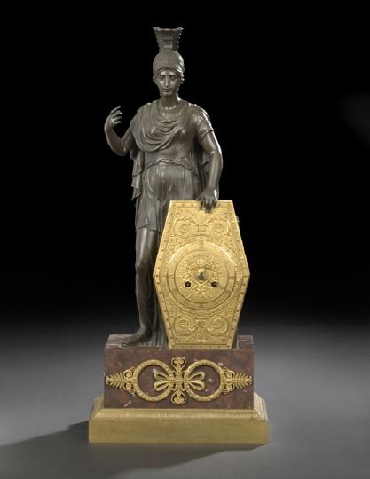 French Bronze and Marble Mantel Clock: Stately French Parcel-Gilt- and Patinated Bronze and Rouge Royale Marble Mantel Clock, second quarter 19th century, in the form of Athena holding her gilded shield on which the clock face appears, the