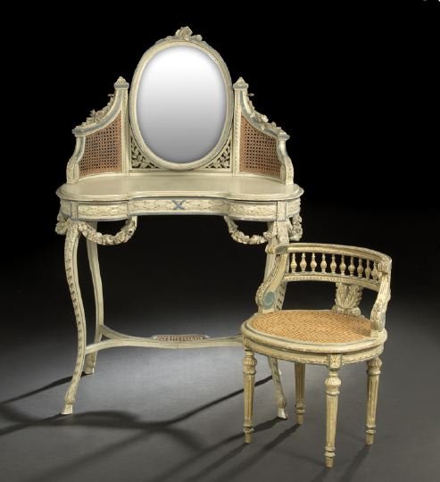 Louis XV-Style Polychromed Vanity Table and Bench: Louis XV-Style Polychromed Vanity Table and Bench, early 20th century, the table with a beveled oval mirror flanked by downswept caned and floral-carved supports, the kitchen-form top above a conformi