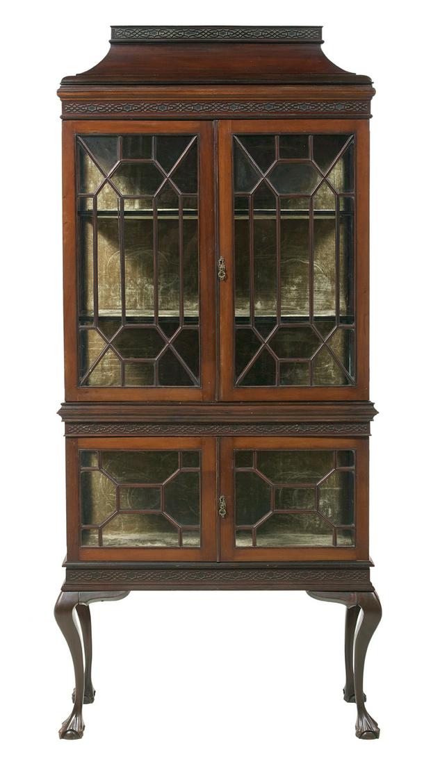 George III-Style Mahogany Vitrine: George III-Style Mahogany Vitrine early 20th century, in the Chinese Chippendale taste, the stepped pediment with blind-fret carving, above a molded like-carved frieze, over astragal-glazed doors, the