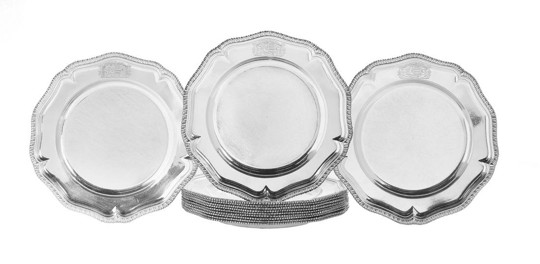 Twelve George II Sterling Silver Service Plates: Set of Twelve George II Sterling Silver Service Plates hallmarked London, 1741-1742, by George Wickes, each with a serpentine-lobed gadrooned edge, engraved on the rim with the drapery-mantled arms of