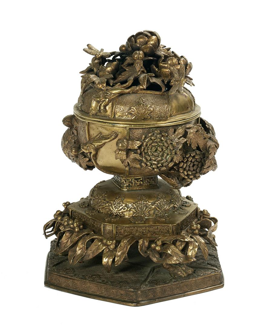 Chinese Bronze Censer: Chinese Bronze Censer first quarter 20th century, the hexagonal censer with a pierced cover decorated with lotus flowers and hares, the body with like decoration, and the leaf-decorated foot with a mo