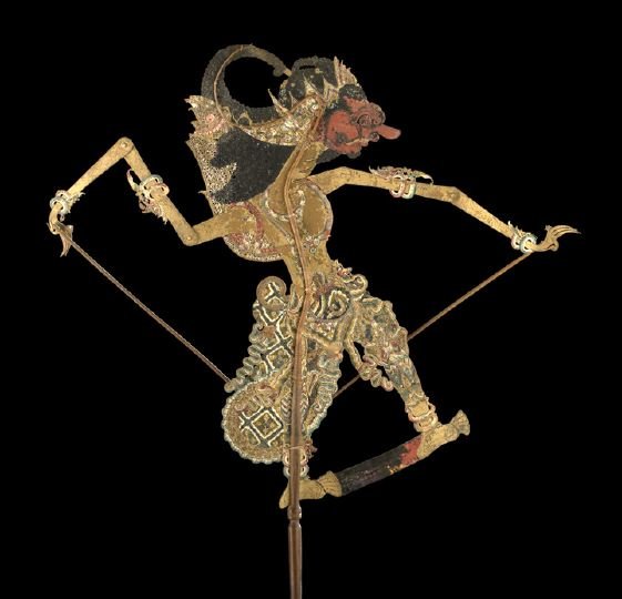 Fine Javanese Shadow Puppet: Fine Javanese Shadow Puppet, pre-1930, the leather body with intricate carving and delicate tracery piercing, the body, clothing and details hand-painted with tempera colors and gilt paint, with a sin