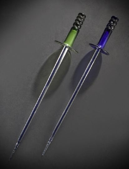 Near-Pair of Rare English Glass Whimsies: Near-Pair of Rare English Glass Whimsies, second quarter 19th century, in the form of 18th-century-style rapiers, one example with a cobalt hilt and guard, l. 17-1/2", the other with a green hilt and 