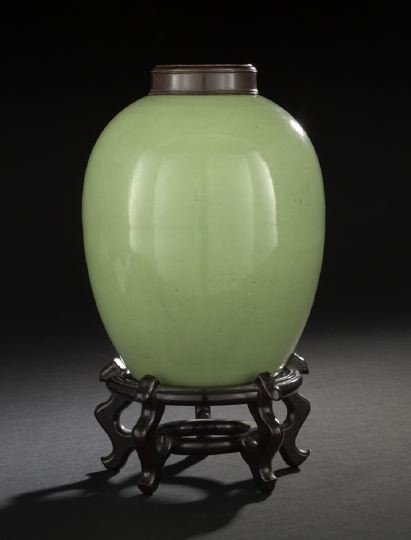 Unusual Chinese Apple Green-Glazed Ginger Jar: Unusual Chinese Apple Green-Glazed Ginger Jar, second half 19th century, of bulbous form tapering to a recessed base, glazed in an apple green glaze overall, with a carved wooden top and later blackwo
