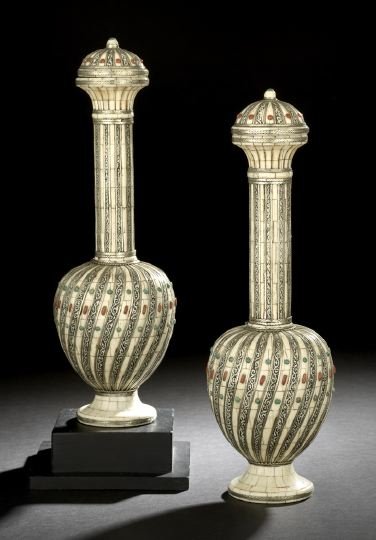 Pair of Indian Covered Long-Neck Garniture Vases: Pair of Indian Covered Long-Neck Garniture Vases, the silver alloy-mounted bone vases in the Moghul taste, the bodies with alternating spiraled white bone ribs set with emerald- and ruby-tinted "jewel