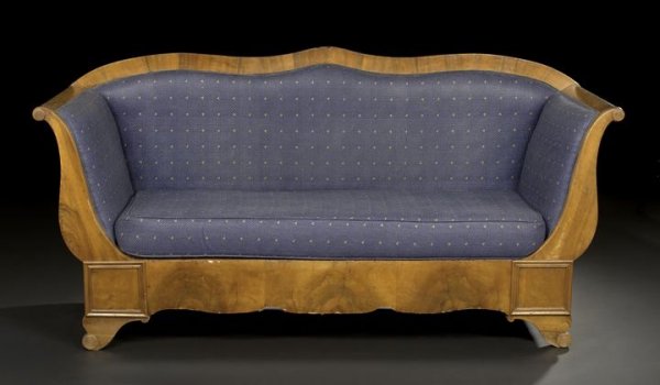 Biedermeier Walnut Settee: Biedermeier Walnut Settee, first quarter 19th century, the shaped and padded back joined by padded outscrolled arms to the cushioned seat above a shaped and paneled apron, raised on bracket feet, h. 3