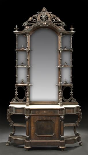 American Rococo Revival Rosewood Etagere: American Rococo Revival Rosewood Etagere, third quarter 19th century, in two parts, the upper section with a projecting arched cornice supporting a pierced foliate-carved crest, over a conforming mirr