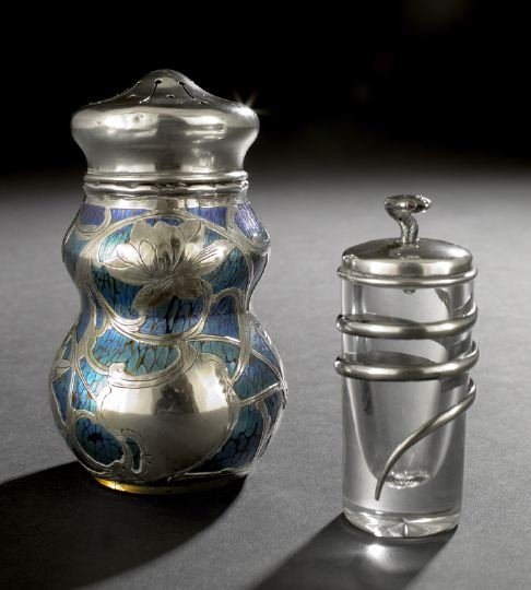 Two Silver Decorative Items: Two Silver Decorative Items, first quarter 20th century, one an unusual Loetz silver-overlay blue-iridized ruby glass vase with later American mounts forming a sugar caster, h. 5-1/4"; and the other a