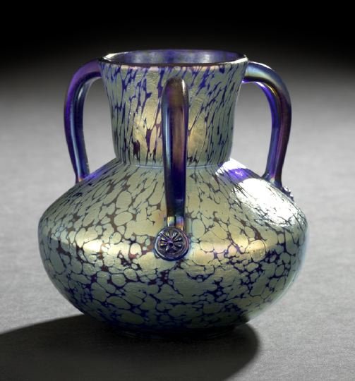 Johann Loetz-Witwe, Klostermuhle, Vase: Johann Loetz-Witwe, Klostermuhle, Triple-Handled Vase, first quarter 20th century, composed of iridized oil spot cobalt blue glass, the lower terminus of each cobalt blue handle with a circular flower