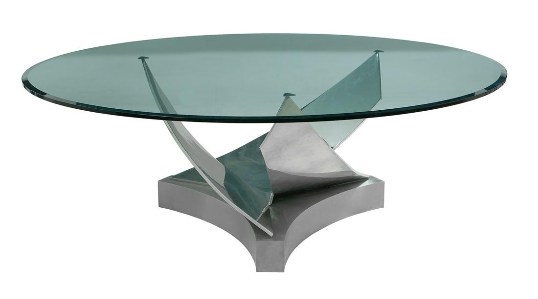 Coronet Table Designed by Ron Seff, New York: Coronet Table Designed by Ron Seff, New York fourth quarter 20th century, the swirl-form stainless steel standard mounted to an in-curved triangular platform base, the circular plate-glass top with a