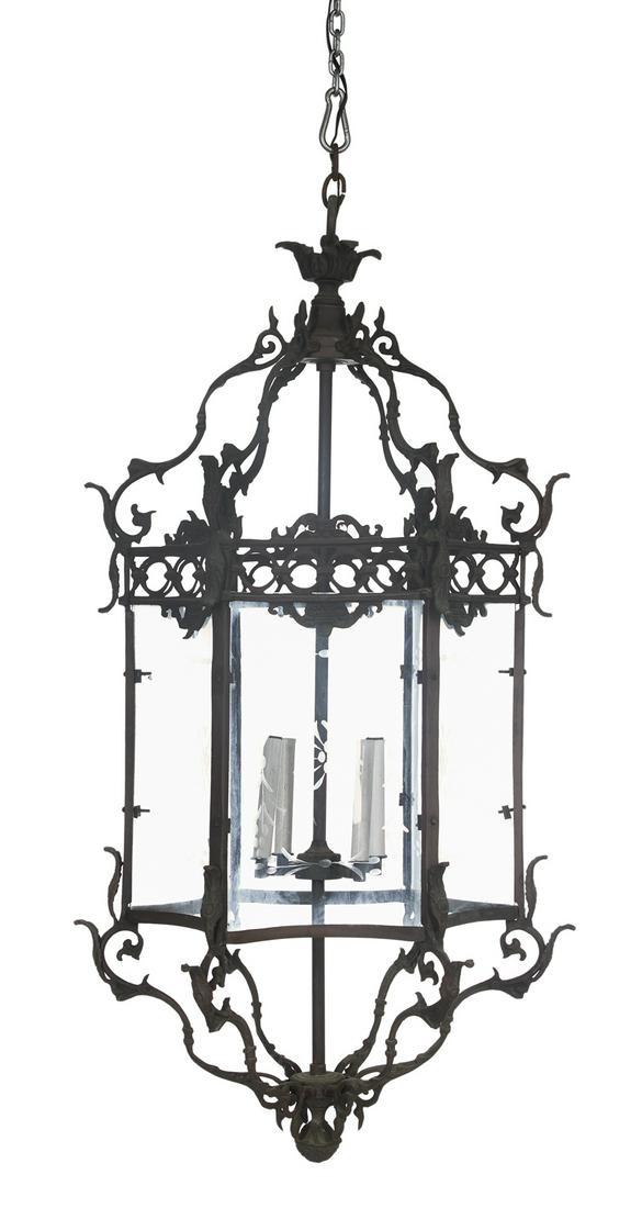 Patinated Bronze Hall Lantern in the Rococo Style: Patinated Bronze Hall Lantern in the Rococo Style the four-light lantern set with concave engraved glass panels, with a ring-pierced upper trim and a scrolled crest, with upper and lower rococo-molded