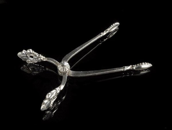 Georg Jensen Silver "Acorn"-Pattern Sugar Tongs: Georg Jensen Sterling Silver "Acorn"-Pattern Sugar Tongs, the pattern designed in 1915 by Johan Rohde (1856-1935), Copenhagen, with the post-1945 Jensen mark, l. 3-1/2", 0.84 t. oz.
