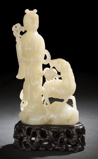Fine Chinese Carved White Jade Figure: Fine Chinese Carved White Jade Figure, depicting the female Immortal Hsi Wang-Mu, the elegantly robed figure standing and holding a slender vase issuing sprays of ling chih fungus, accompanied by a de
