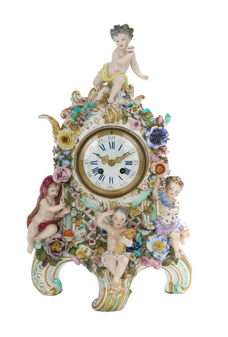 Meissen Porcelain "Four Seasons" Mantel Clock: Meissen Porcelain "Four Seasons" Mantel Clock fourth quarter 18th century, German, in the rococo taste, the top finial representing the summer wine, the lower center figure representing the autumn whe