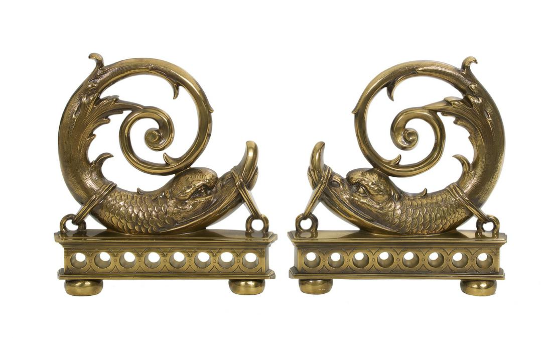 Pair of Empire-Style Molded Brass Andirons: Pair of Empire-Style Molded Brass Andirons ca. 1900, each modeled with a stylized restrained dolphin, its tail arching up into an acanthine scroll, above a pierced base, with cast iron billet bars. h.