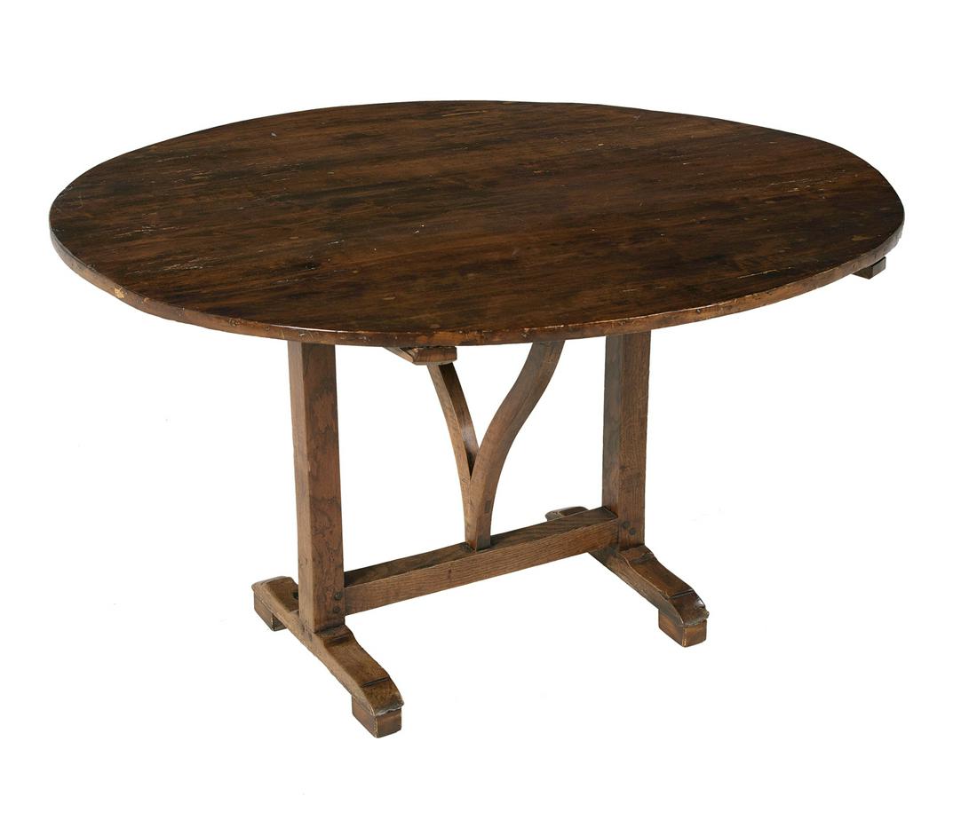 French Provincial Fruitwood Wine Table: French Provincial Fruitwood Wine Table 19th century, the tilting circular top raised on a swing-leg base and upright supports to runner feet. h. 28", dia. 48" Provenance: Private collection, New Orlea