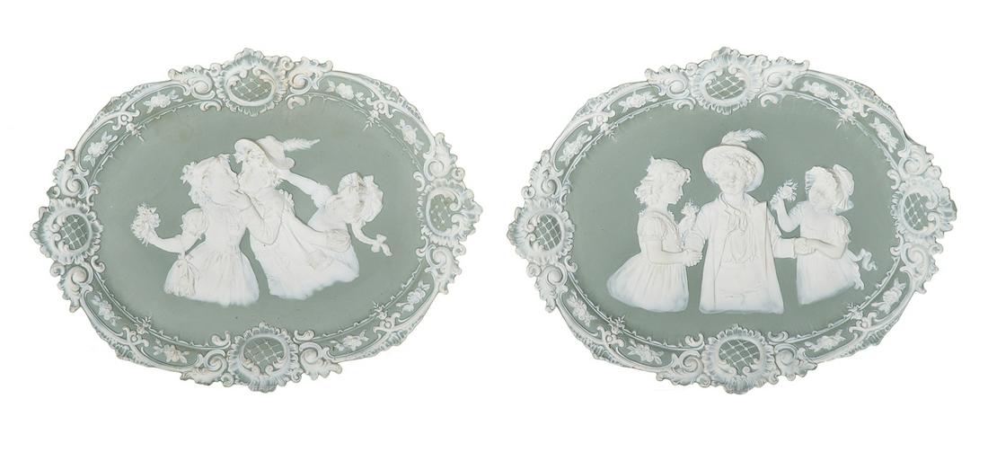 Pair of Biscuit Porcelain Plaques of Children: Pair of Biscuit Porcelain Plaques of Children fourth quarter 19th century, probably German, with rococo borders, the backs with stamped pattern numbers. h. 9-1/2", w. 12-1/4"