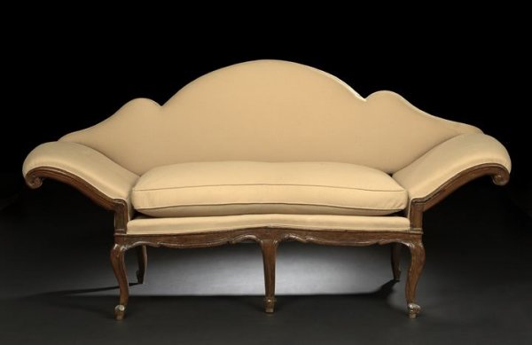 Northern Italian Walnut Settee: Northern Italian Walnut Settee, early 19th century, in the rococo taste, the padded and domed back removable to form a window seat, joined by dramatically out-swept padded arms to the shaped cushioned