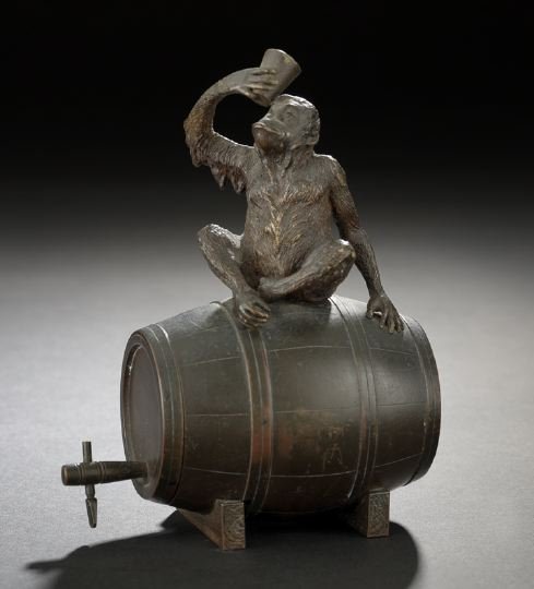 Bronze Figure of a Chimpanzee Atop a Wine Barrel: Franz Bergmann Patinated Vienna Bronze Figure of a Chimpanzee Atop a Wine Barrel, first quarter 20th century, by the foundry of Franz Bergmann (1830-1894) under the direction of his son Franz Xavier B