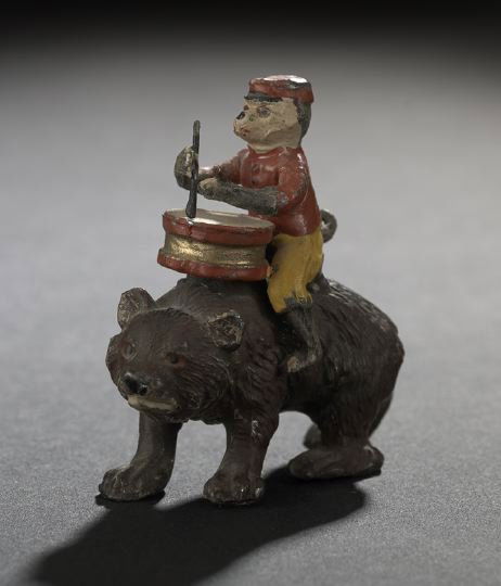 Vienna Bronze Lead Figure of a Monkey and Bear: "Vienna Bronze" Lead Figure of a Monkey and Bear, fourth quarter 19th century, the polychromed group depicting a drummer monkey riding a brown bear, h. 2-1/4", l. 2-1/4".