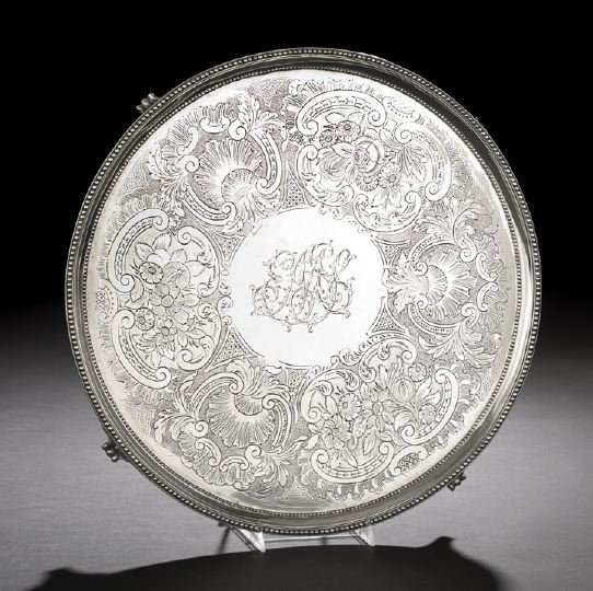 George III Sterling Silver Salver: George III Sterling Silver Salver, hallmarked London, 1786-1787, by Elizabeth Jones, of circular form with beaded edge and raised on four beaded triangular feet, the plateau engraved with a wide band 