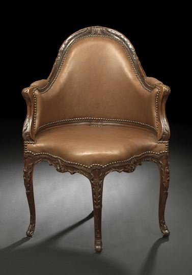 Provincial Louis XV-Style Bergere en Encoignure: Provincial Louis XV-Style Walnut Bergere en Encoignure, mid-19th century, the domed and padded back surmounted by a foliate-carved crest and joined by downswept arms and foliate uprights to the padded