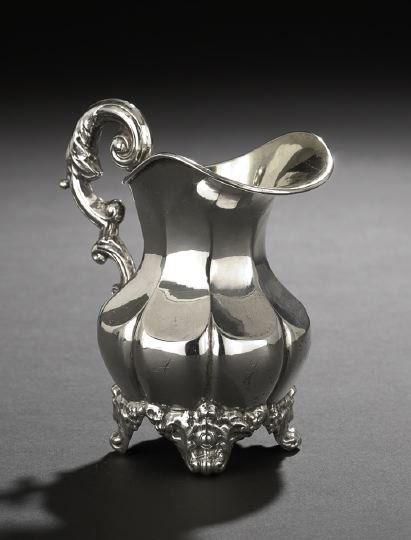 Swedish Oscar I .830 Silver Cream Jug: Swedish Oscar I .830 Silver Cream Jug, marked Stockholm, 1855, by Caron & Ambrosius, the lobed, pear-shaped body paneled on the upper half, with broad integral spout, elaborate acanthus-crested double