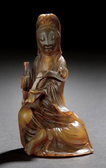 Chinese Horn Figure of the Goddess Guanyin: Chinese Carved Horn Figure of the Goddess Guanyin, 19th century, the cowled figure in a seated position holding a ruyi scepter in one hand and a bottle vase in the other, h. 4-1/4".