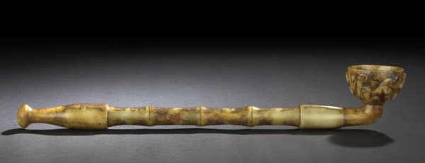 Large Chinese Carved Soapstone Opium Pipe: Large Chinese Carved Soapstone Opium Pipe, the yellow and brown mottled stone carved imitating a bamboo shaft with a hemispheric bowl carved in low relief with two dragons, the shaft with archaic char