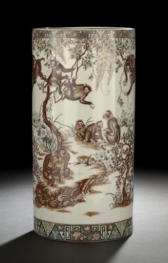 Chinese Export Porcelain Umbrella Stand: Chinese Export Porcelain Umbrella Stand, 20th century, of tall cylindrical form, decorated in polychrome enamels with a continuous design of monkeys cavorting among trees, wisteria and flowers, h. 18-