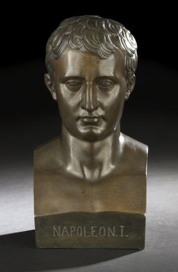 After Antonio Canova (Italian, 1757-1822): After Antonio Canova (Italian, 1757-1822), a large patinated bronze tabletop bust of the youthful Emperor Napoleon I, third quarter 19th century, the facade edge entitled, signed "Canova" at the prope