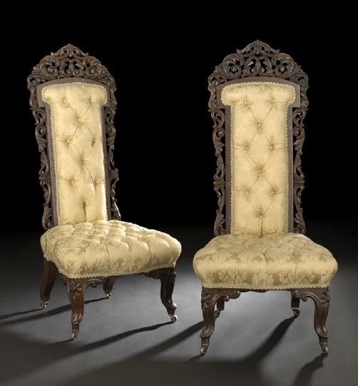 Pair of American Rococo Revival Slipper Chairs: Pair of American Rococo Revival Rosewood Hall or Slipper Chairs, mid-19th century, Baltimore, Maryland, each with pierced foliate and scroll carving adorning the crest and stiles, with serpentine fron