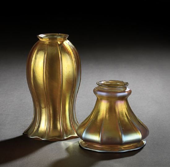 Group of Two "Gold Aurene" Glass Shades: Group of Two "Gold Aurene" Glass Shades, first quarter 20th century, one a tall iridized "Gold Aurene" glass ribbed tulip-form shade attributed to the Steuben Glass Works, Corning, New York, h. 7-1/4"