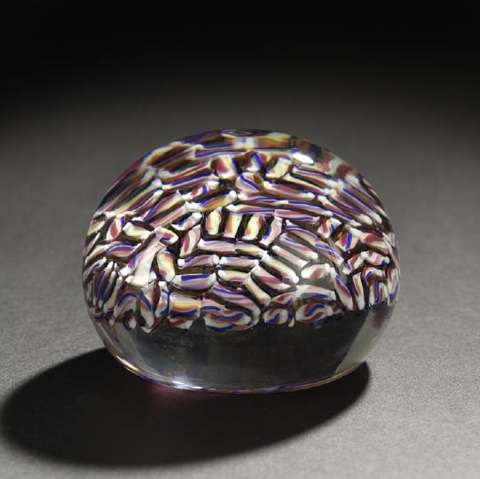 Attractive Baccarat Glass Paperweight: Attractive Baccarat Glass Paperweight, in "Plaid Cane" decor, the base with the acid-stamped Baccarat "decanter" mark, h. 1-3/4", dia. 3-1/4".