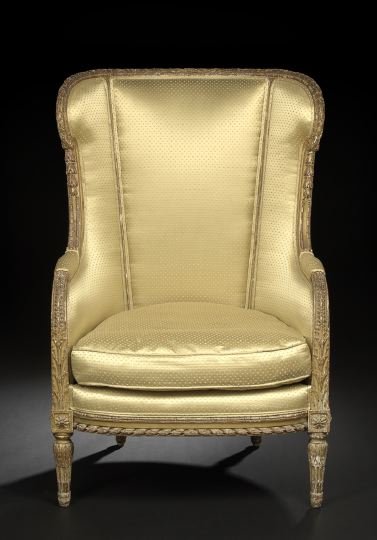 Louis XVI-Style Giltwood Bergere avec Orielles: Louis XVI-Style Giltwood Bergere avec Orielles, early 20th century, the padded back and shaped sides within a laurel leaf-carved and annulated frame, joined to the cushioned seat by downswept arms, ra